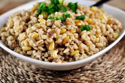 Barley-rice pilaf with chopped carrot and celery