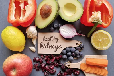 Fresh vegetables and fruit with a tag reading healthy kidneys
